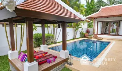 Luxurious tropical villa with private pool and lush garden, perfect for relaxation and leisure.