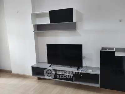 Modern living room with sleek TV stand and wall-mounted shelves, perfect for contemporary urban living.