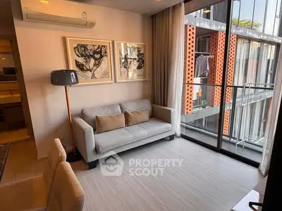 Modern living room with large window and stylish decor in urban apartment