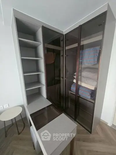 Modern study room with sleek glass cabinets and stylish desk