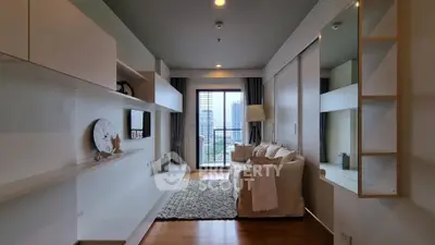 Modern living room with cozy sofa and city view balcony, elegant decor and natural light.