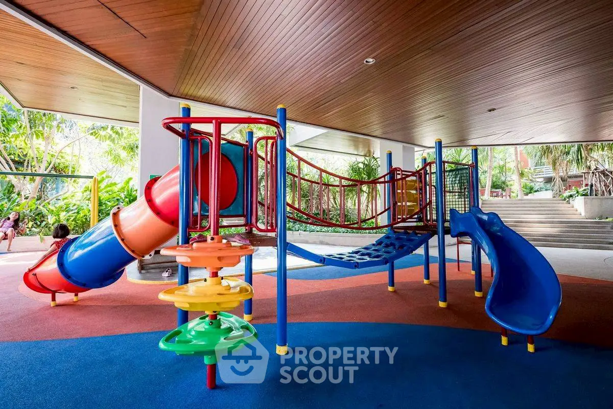 Vibrant indoor playground area in a modern residential complex