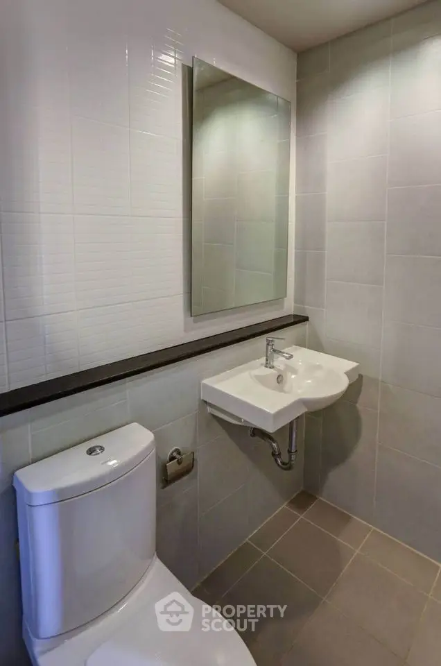Modern bathroom with sleek design and wall-mounted sink