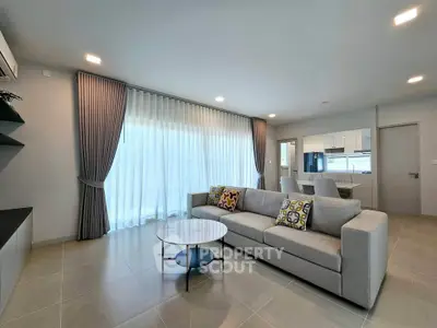 Spacious modern living room with elegant decor and natural light