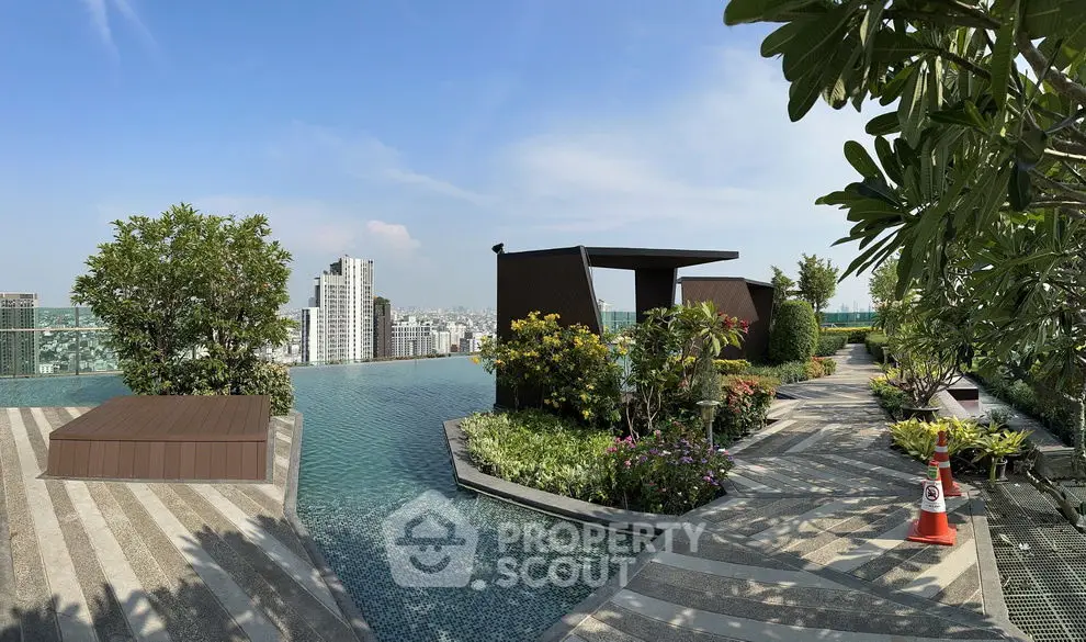 Luxurious rooftop pool with stunning city view and lush greenery