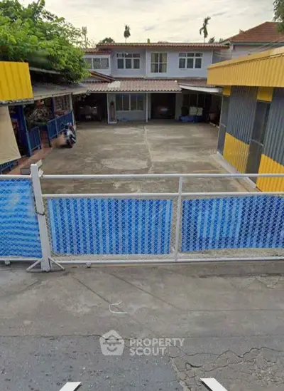 Spacious property with ample courtyard and secure fencing, ideal for residential or commercial use.