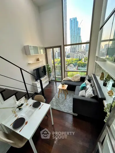 Stunning modern living room with high ceilings and city view, featuring sleek furniture and elegant decor.