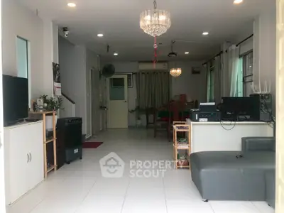 Spacious living room with modern decor and ample natural light