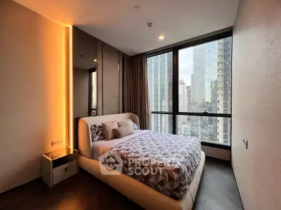 Modern bedroom with city view and stylish lighting in high-rise apartment