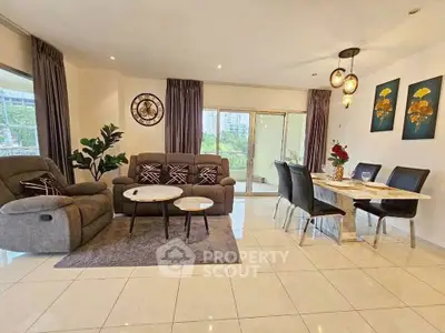 Spacious modern living room with elegant dining area and large windows.
