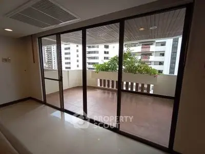 Spacious balcony with city view in modern apartment
