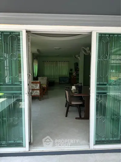 Spacious living room with sliding glass doors and elegant interior design