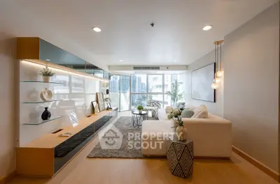 Luxurious modern living room with elegant decor and city view, featuring stylish furniture and ambient lighting.