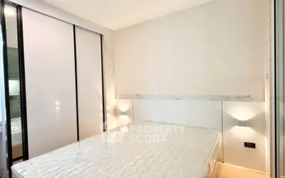 Modern bedroom with sleek design and built-in wardrobe, perfect for urban living.