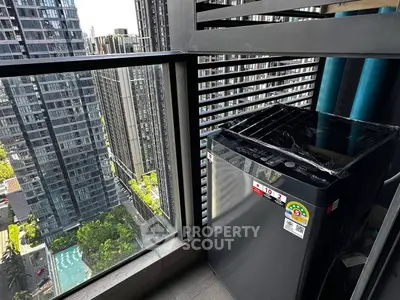 Modern balcony with city view and washing machine, perfect for urban living.