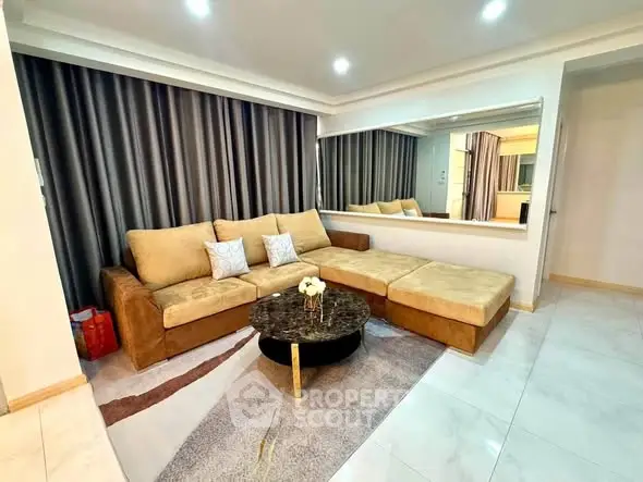 Spacious living room with modern sectional sofa and elegant decor