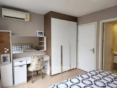 Modern bedroom with stylish decor and built-in wardrobe