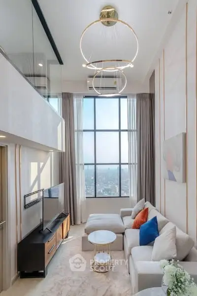 Luxurious high-ceiling living room with modern decor and large windows offering stunning city views.