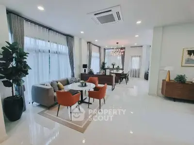 Spacious modern living room with elegant decor and ample natural light