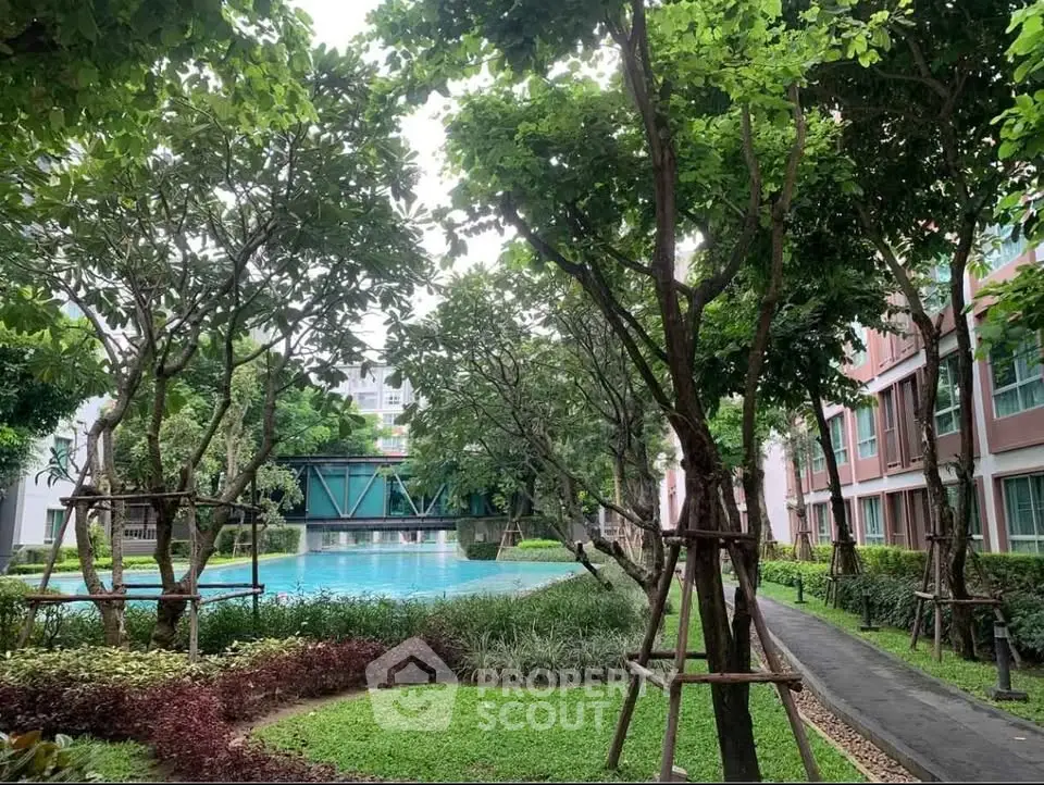 Lush garden view with pool in modern residential complex