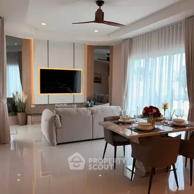 Luxurious living room with modern decor and large windows