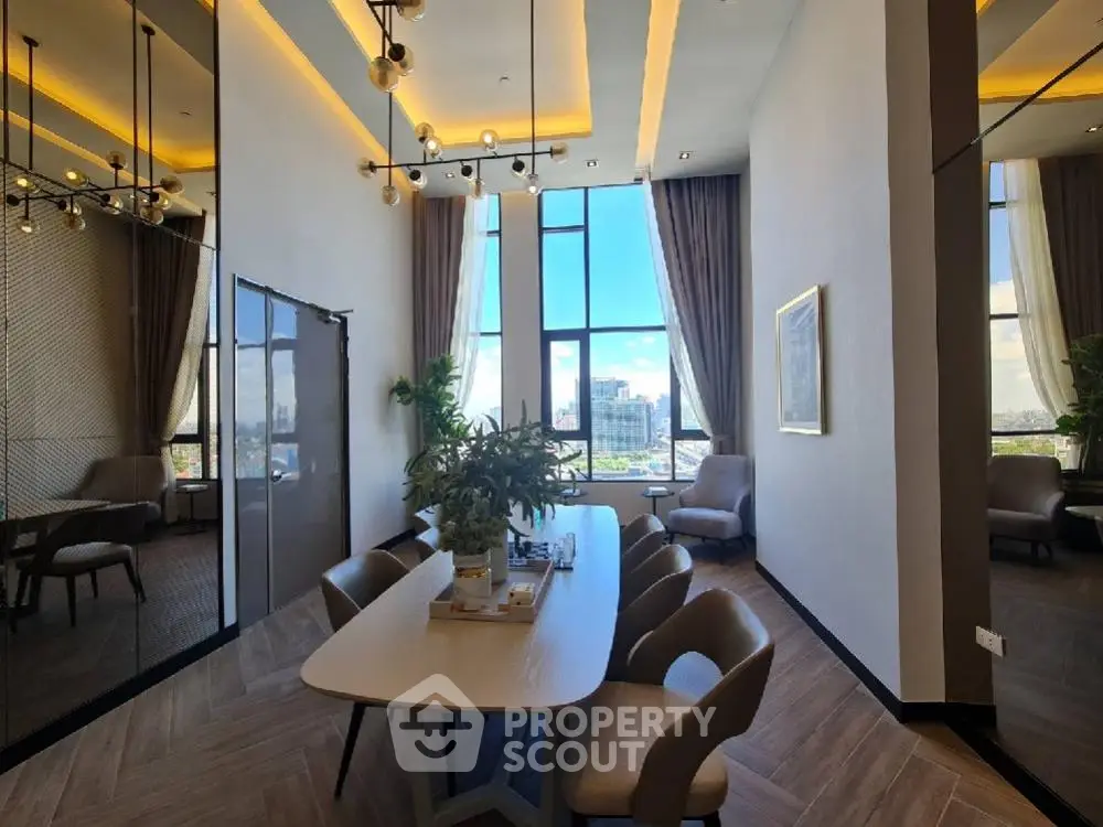 Luxurious dining area with high ceilings and panoramic city view, featuring elegant lighting and modern decor.