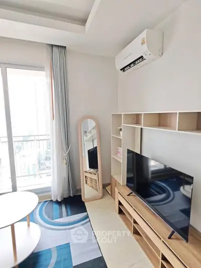 Modern living room with stylish decor and balcony view