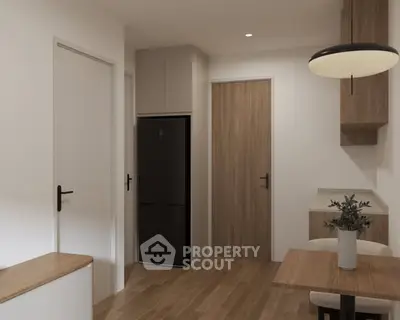 Modern kitchen with sleek design and wooden accents, featuring a built-in fridge and stylish lighting.