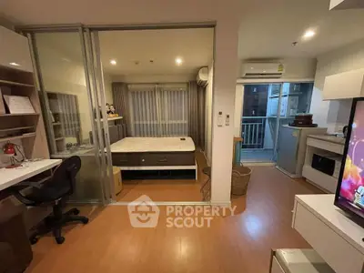 Modern studio apartment with open layout and balcony access