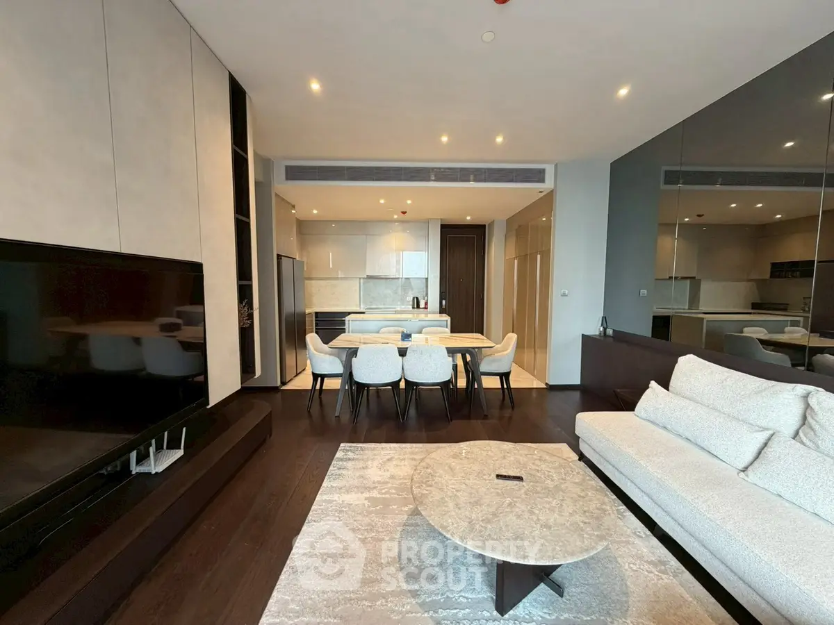 Luxurious modern living room with open kitchen and elegant dining area