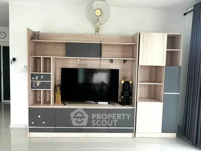 Modern living room with sleek entertainment center and stylish decor