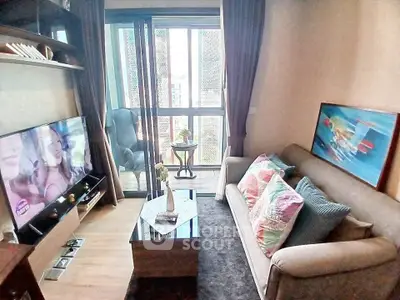 Charming living room with cozy sofa, modern decor, and balcony access in a stylish apartment.