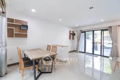 Spacious modern dining area with large windows and stylish furniture