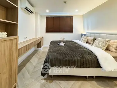 Modern bedroom with stylish decor and natural light