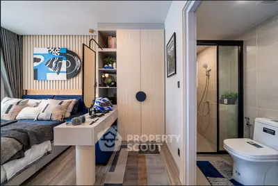 Modern bedroom with ensuite bathroom, stylish decor, and cozy ambiance.
