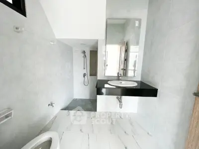 Modern bathroom with sleek fixtures and elegant tile design