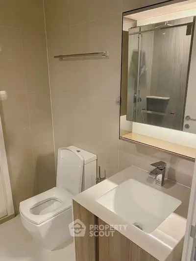 Modern bathroom with sleek fixtures and elegant design in a contemporary apartment.