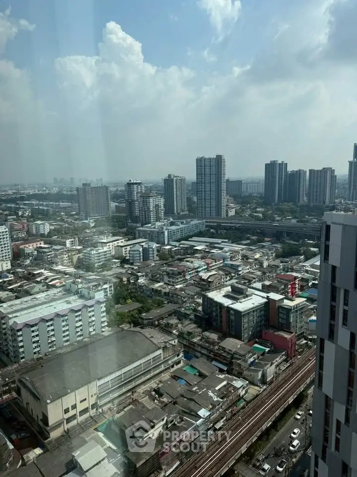 Stunning cityscape view from high-rise building showcasing urban skyline and vibrant city life.