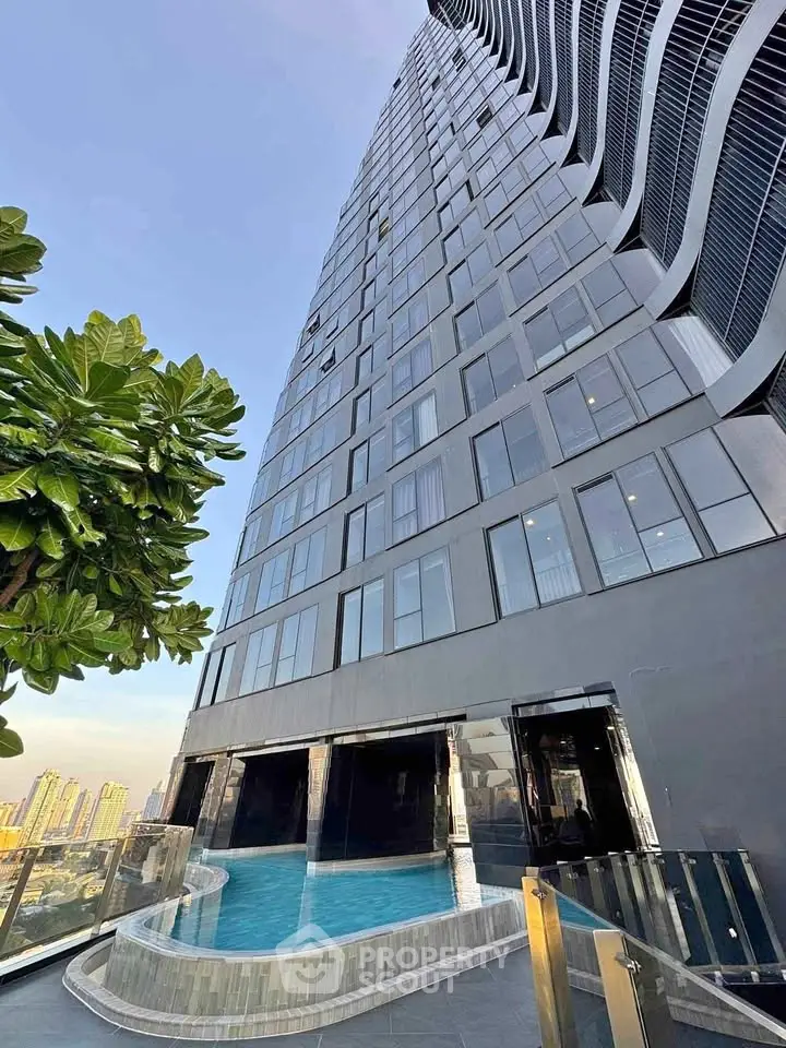 Stunning modern high-rise building with pool and city view