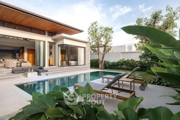 Luxurious modern villa with private pool and lush garden, perfect for relaxation and entertaining.