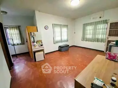 Spacious living room with natural light and minimalist decor