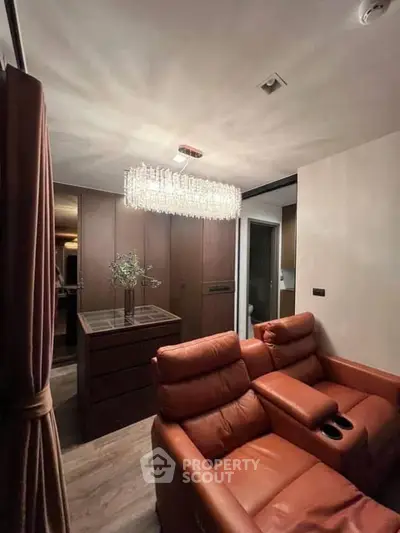 Luxurious living room with elegant leather seating and modern lighting