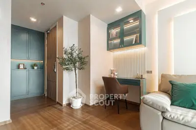 Stylish modern living room with cozy seating and elegant workspace