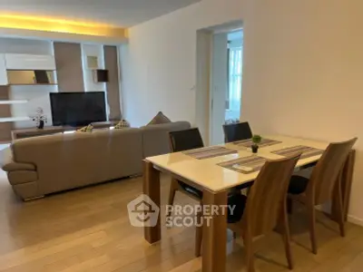 Modern living room with elegant dining area and stylish furniture