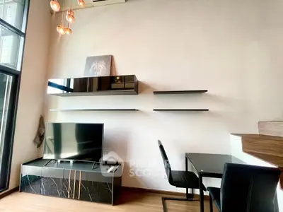 Modern living room with sleek TV unit and stylish lighting