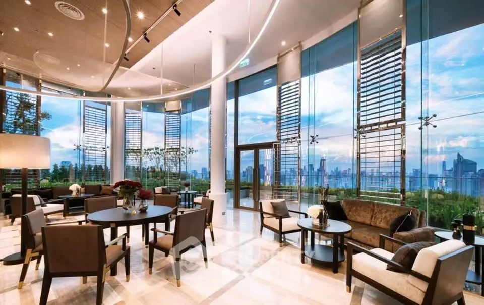 Luxurious modern living room with panoramic city views and elegant furnishings.
