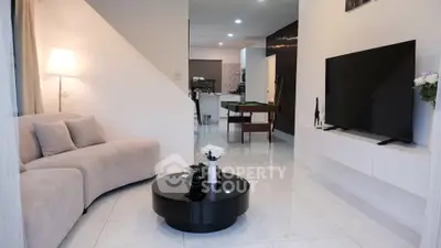 Modern living room with sleek furniture and open layout, perfect for relaxation and entertainment.