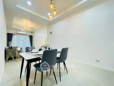 Modern dining area with elegant lighting and stylish decor