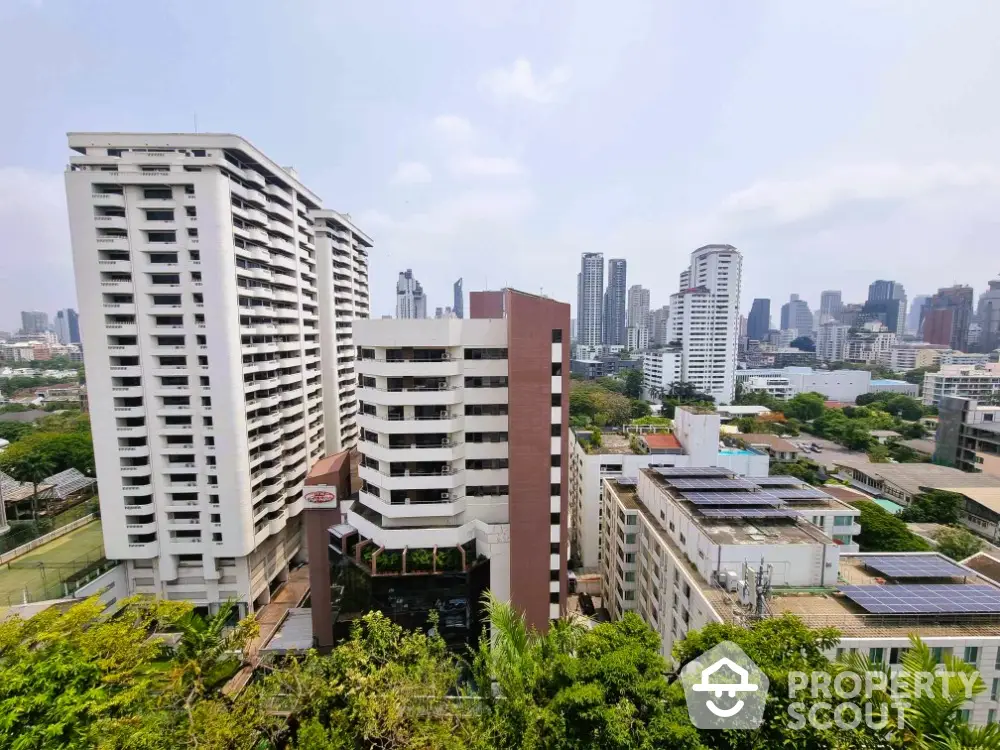 Stunning cityscape view with modern high-rise buildings and lush greenery, perfect for urban living.