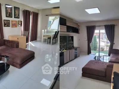 Spacious living room with modern furniture and large windows for natural light.